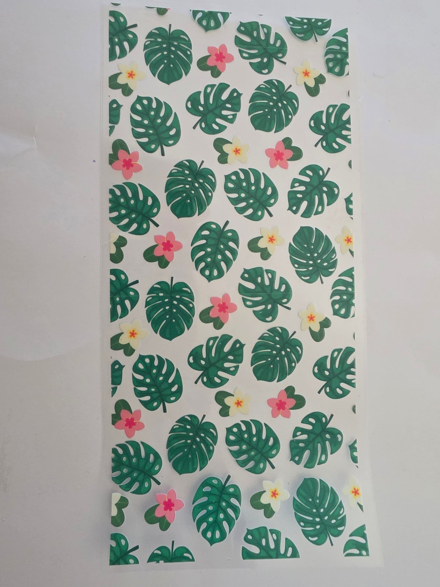 Monstera tropical leaves and flowers